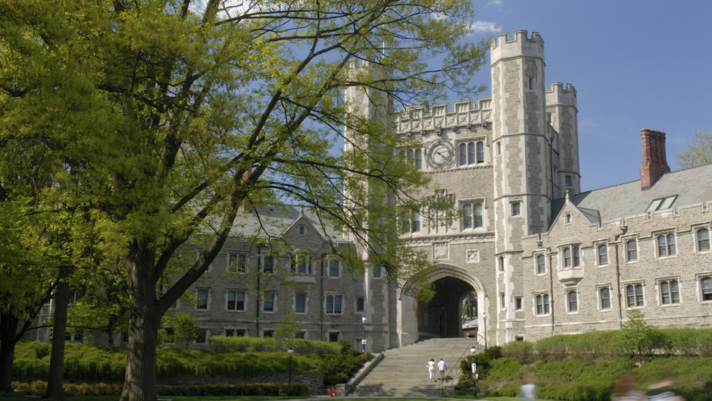 One of the pathways through a a massive stone building on the Princeton campus.